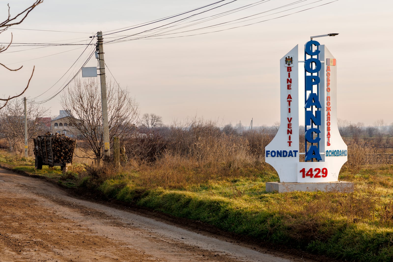 A trailer with fire wood for sale is parked on the side of the road in Copanca, Moldova, Wednesday, Jan. 8, 2025. (AP Photo)