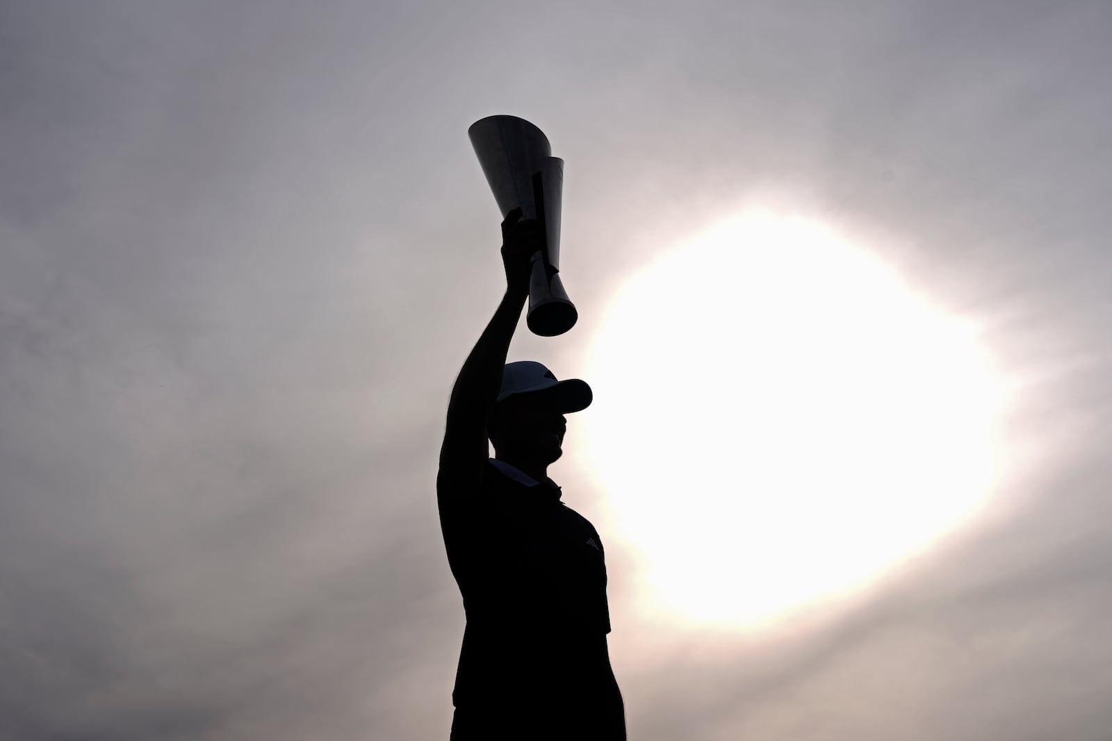 Ludvig Åberg, of Sweden, poses with the trophy after winning the Genesis Invitational golf tournament Sunday, Feb. 16, 2025, in San Diego. (AP Photo/Gregory Bull)