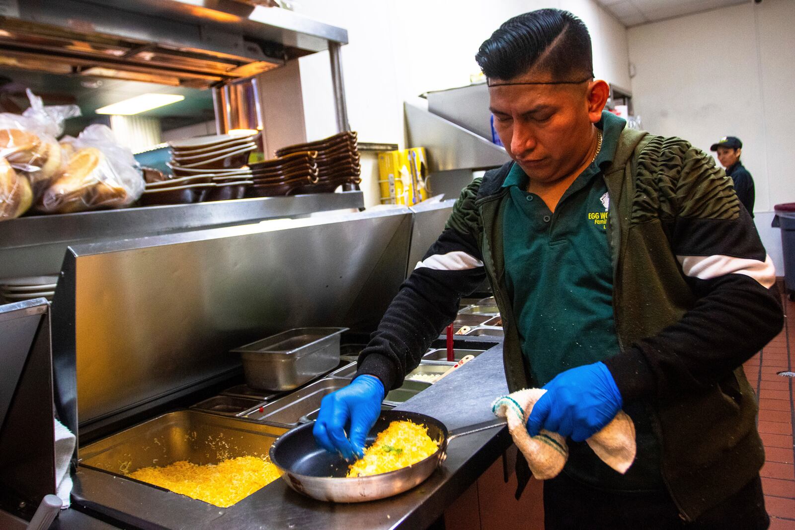 Chef Pato Aianel makes an omelet at Eggs Works restaurant Thursday, Feb. 13, 2025, in Las Vegas. (AP Photo/Ty ONeil)