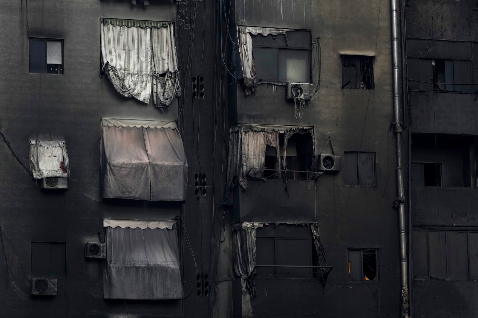 A burnt out building at the site of an Israeli airstrike in Beirut's southern suburb, Lebanon, Tuesday, Oct. 1, 2024. (AP Photo/Hassan Ammar)