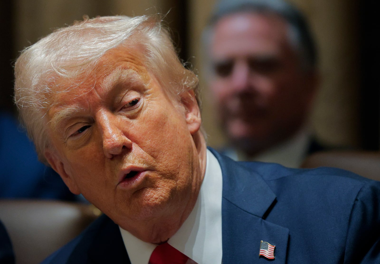 President Donald Trump speaks during a Cabinet meeting at the White House in Washington, Tuesday, Feb. 26, 2025. (Pool via AP)