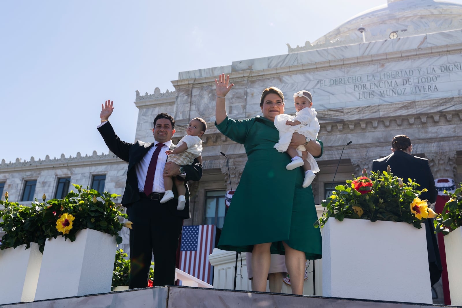 Jenniffer Gonzalez Colon and her husband wave with their children during Colon's swearing-in ceremony as governor outside the Capitol in San Juan, Puerto Rico, Thursday, Jan. 2, 2025. (AP Photo/Alejandro Granadillo)