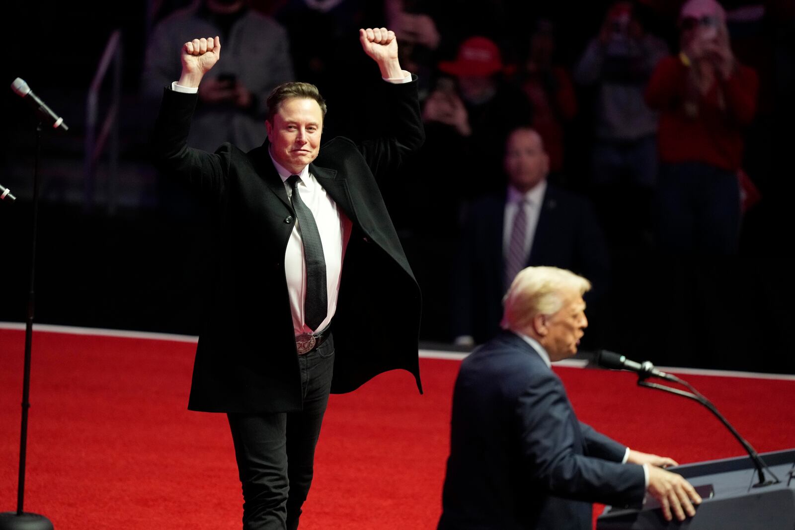 Elon Musk reacts as President-elect Donald Trump speaks at a rally ahead of the 60th Presidential Inauguration, Sunday, Jan. 19, 2025, in Washington. (AP Photo/Alex Brandon)