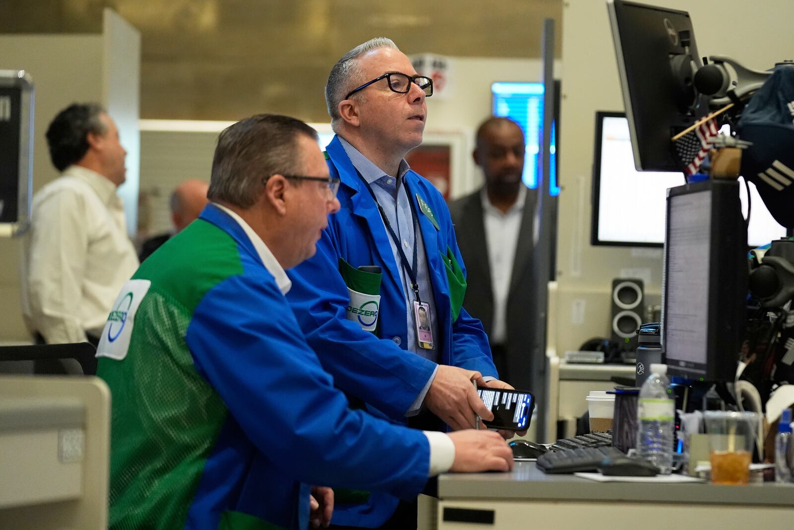 People work on the options floor at the New York Stock Exchange in New York, Wednesday, March 19, 2025. (AP Photo/Seth Wenig)