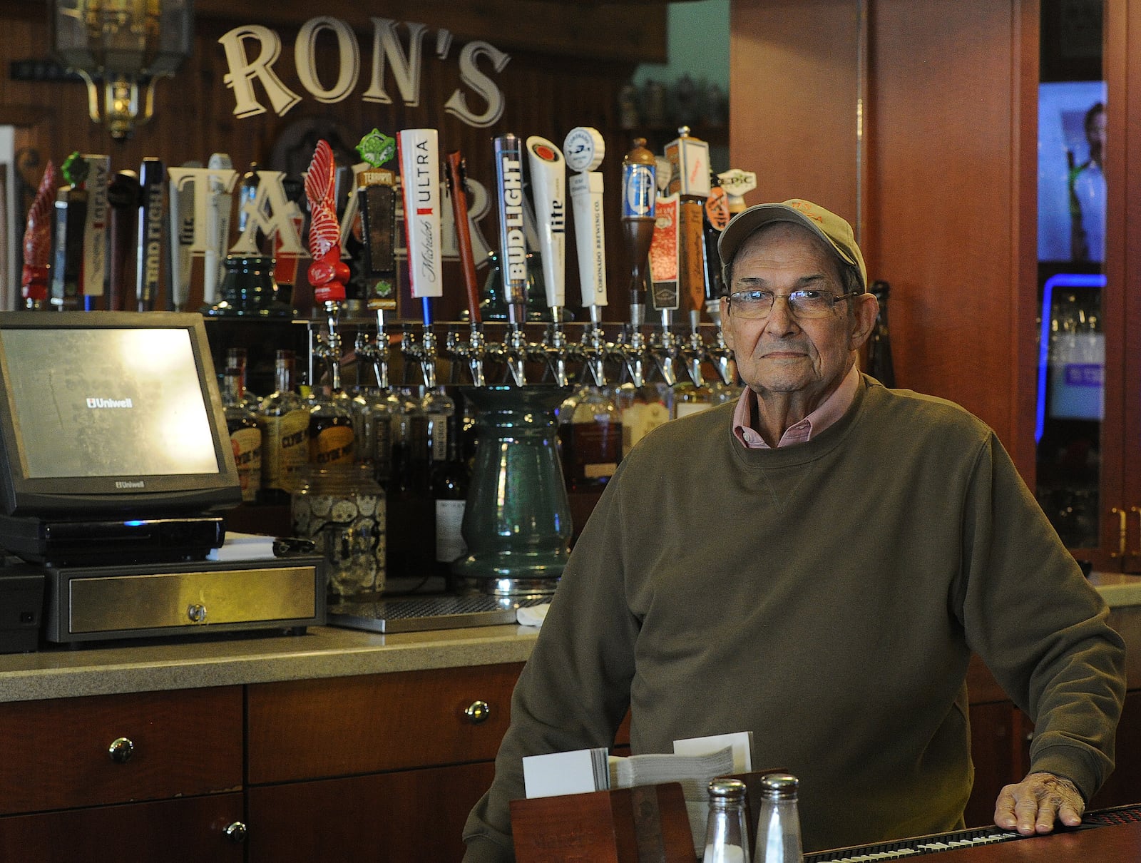 Ron Holp stands behind the bar at Ron's Tavern Thursday, Jan. 5, 2023 with a remodeled new draft beer system with a more expansive selection and 12 taps. The tavern and Ron's Pizza are wrapping up remodeling that has taken more than a year. MARSHALL GORBY\STAFF