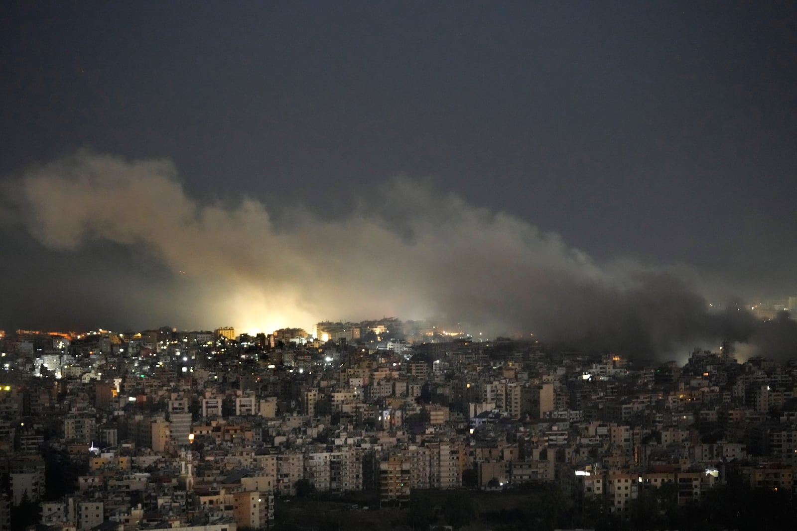 Smoke rises from an Israeli airstrike on Dahiyeh, in the southern suburb of Beirut, Lebanon, Sunday, Oct. 20, 2024. (AP Photo/Hussein Malla)