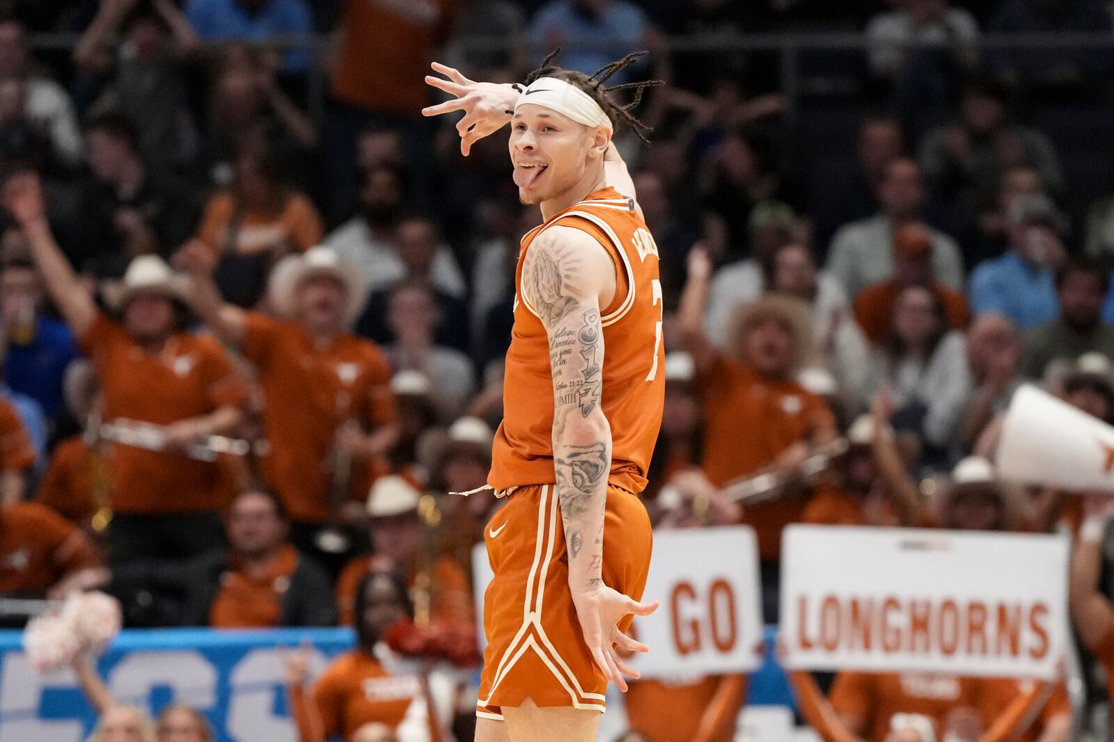 Texas' Chendall Weaver reacts during the first half of a First Four college basketball game against Xavier in the NCAA Tournament, Wednesday, March 19, 2025, in Dayton, Ohio. (AP Photo/Jeff Dean)