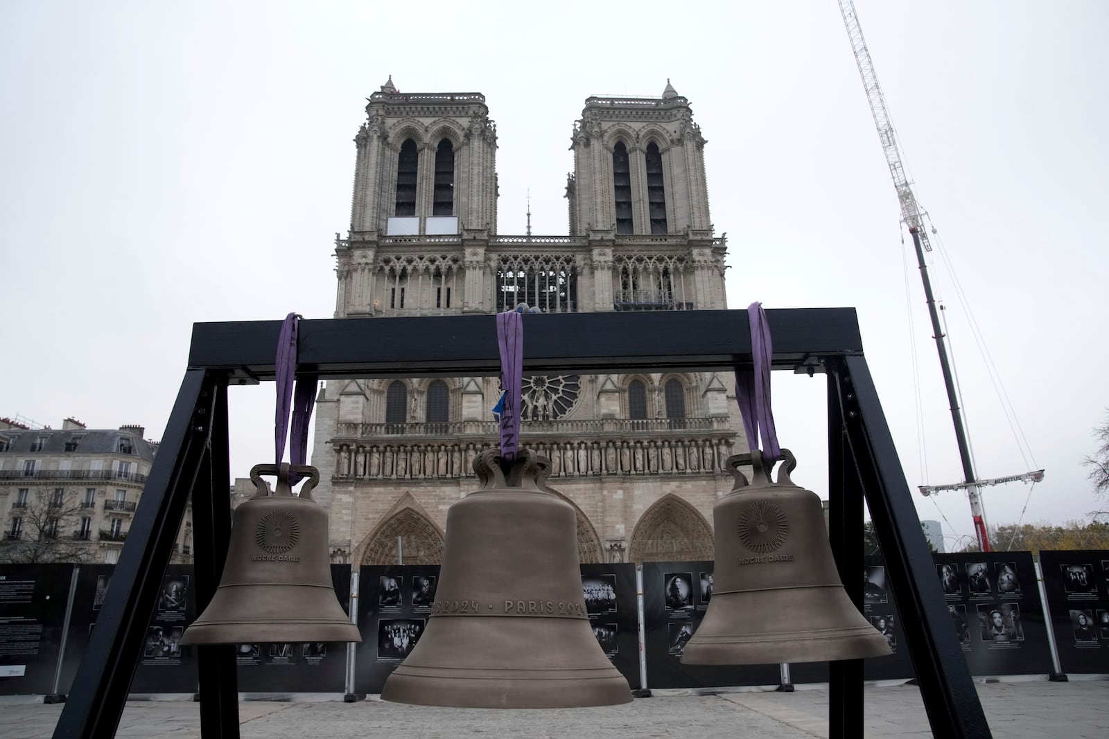 A bell, center, that Olympic medalists rang at the Paris Games, is seen before being installed in Notre Dame Cathedral, ahead of the monument's grandiose reopening following a massive fire and five-year reconstruction effort, Thursday, Nov. 7, 2024 in Paris. (AP Photo/Christophe Ena)