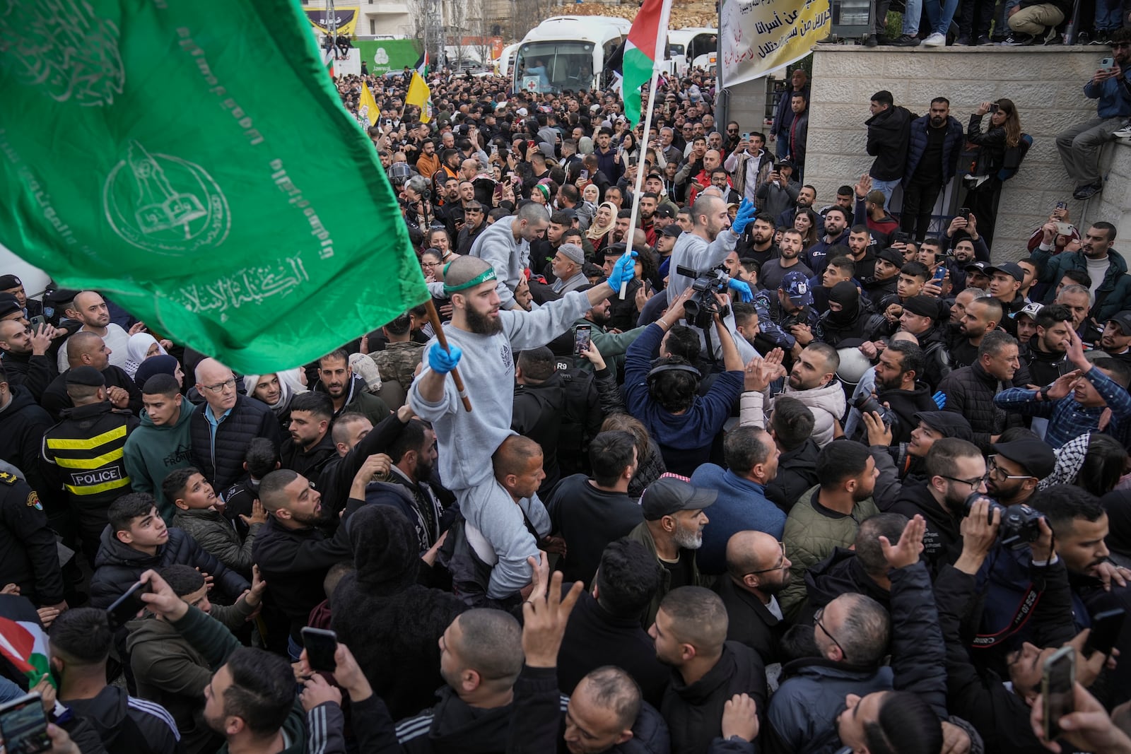 Released Palestinian prisoners are carried on the shoulders of supporters as a crowd greets them in the West Bank city of Ramallah, Saturday, Jan. 25, 2025.(AP Photo/Mahmoud Illean)