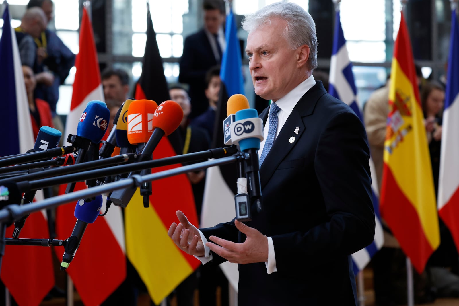 Lithuania's President Gitanas Nauseda speaks with the media as he arrives for an EU Summit at the European Council building in Brussels, Thursday, March 6, 2025. (AP Photo/Omar Havana)