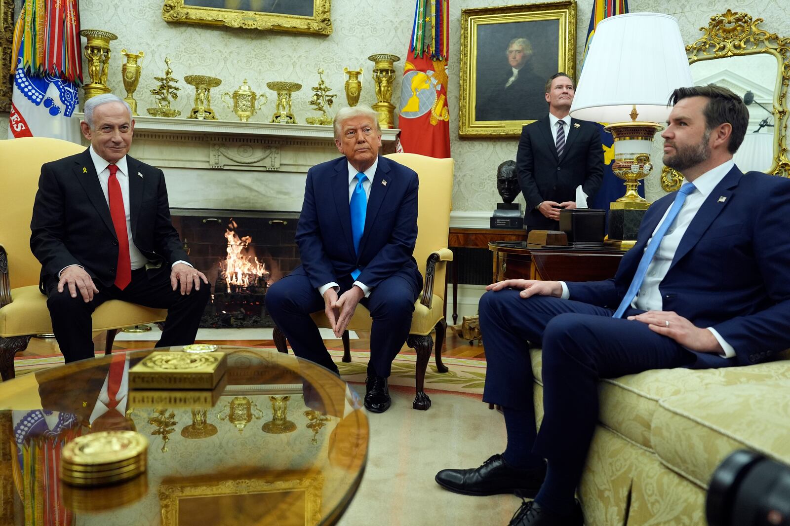 President Donald Trump meets with Israel's Prime Minister Benjamin Netanyahu in the Oval Office of the White House, Tuesday, Feb. 4, 2025, in Washington, as Vice President JD Vance listens. (AP Photo/Evan Vucci)