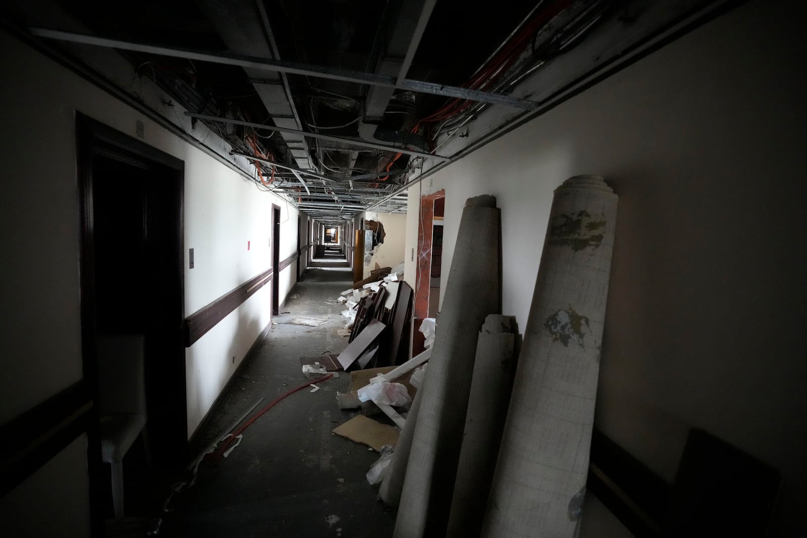 A view of a corridor at Hotel Yugoslavia, once a symbol of progress in the former socialist state of Yugoslavia that broke apart in the 1990s and a favorite gathering place for local residents as well as world leaders, in Belgrade, Serbia, Thursday, Oct. 3, 2024. (AP Photo/Darko Vojinovic)