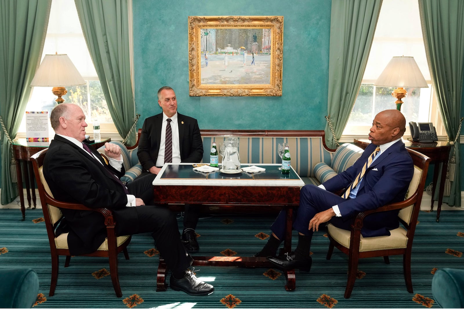 This image provided by the Office of the New York Mayor shows New York Mayor Eric Adams, right, meeting with President-elect Donald Trump's incoming "border czar" Tom Homan, left, and President Joe Biden's Department of Homeland Security Official Kenneth Genalo at Gracie Mansion, in New York, Thursday, Dec. 12, 2024. (Mayoral Photography Office/Michael Appleton via AP)