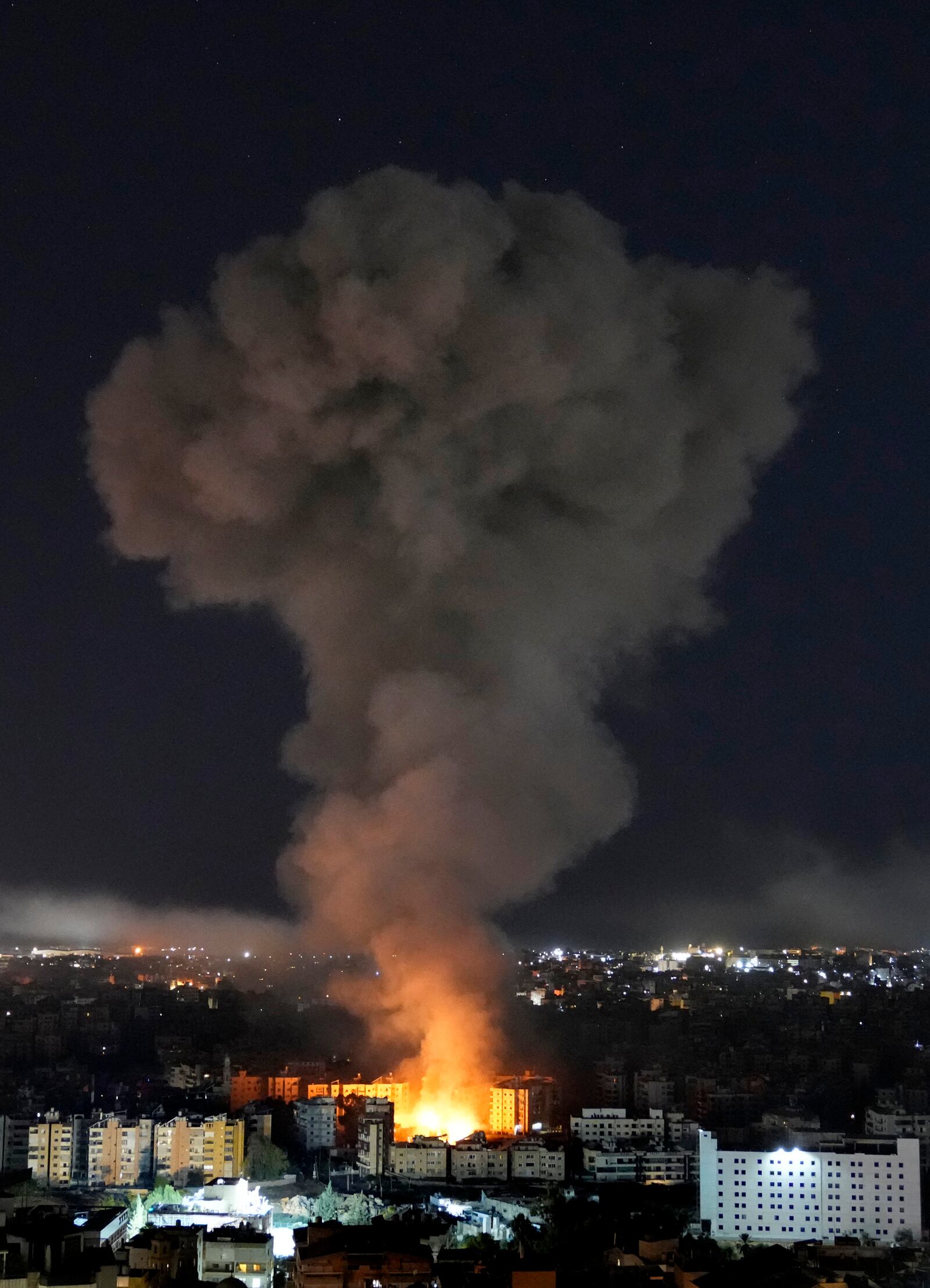 Flame and smoke rise from buildings hit by Israeli airstrikes on Dahiyeh, in the southern suburb of Beirut, Lebanon, Wednesday, Oct. 23, 2024. (AP Photo/Hussein Malla)