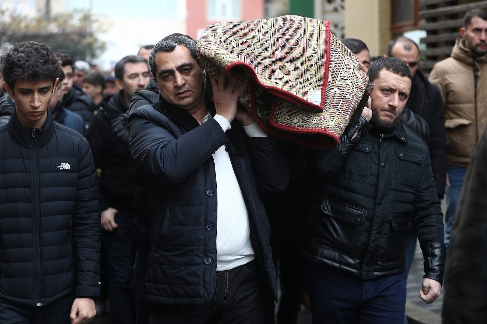 People attend a funeral of Mahammadali Eganov who died in the Azerbaijan Airlines Embraer 190 crash near the Kazakhstan's airport of Aktau at the age of 13, in Baku, Azerbaijan, Saturday, Dec. 28, 2024. (AP Photo)