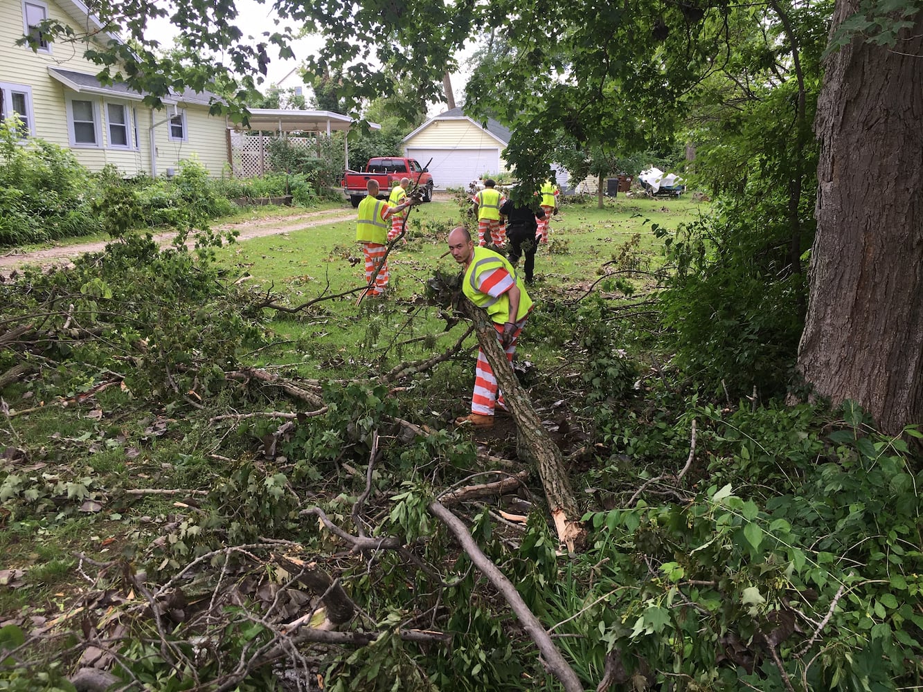 PHOTOS: Tornado-damaged communities dig out, clean up