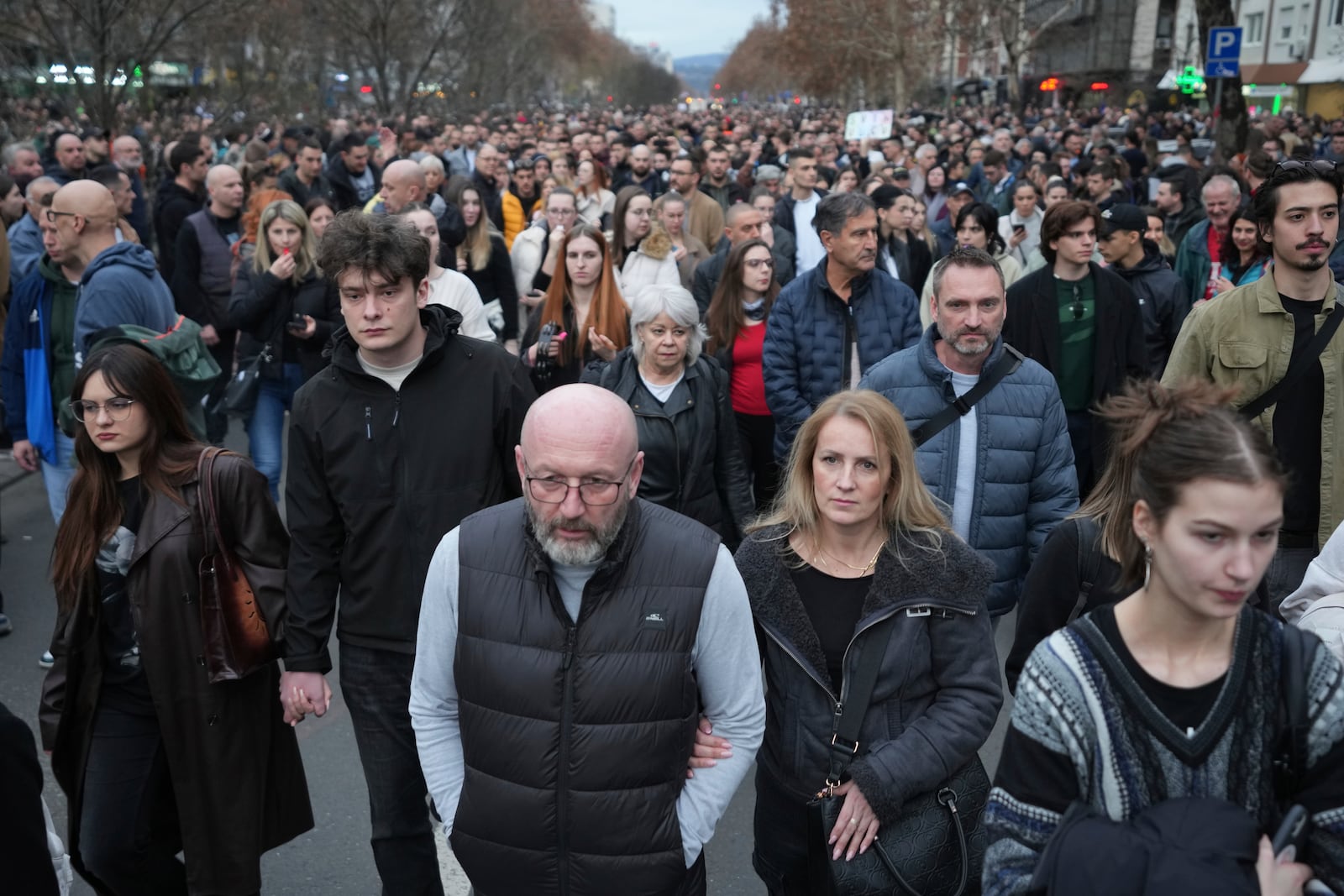 People march during a protest, a day after the assault on students was carried out by thugs with baseball bats, in Novi Sad, Serbia, Tuesday, Jan. 28, 2025. (AP Photo/Darko Vojinovic)