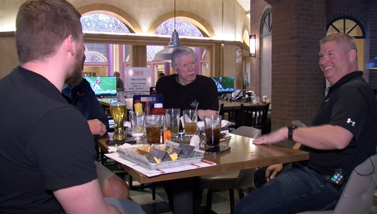 Nathan Guard, right, enjoys lunch at Barstool Sports Book in Lawrenceburg with his father, Stan. LOT TAN/WCPO