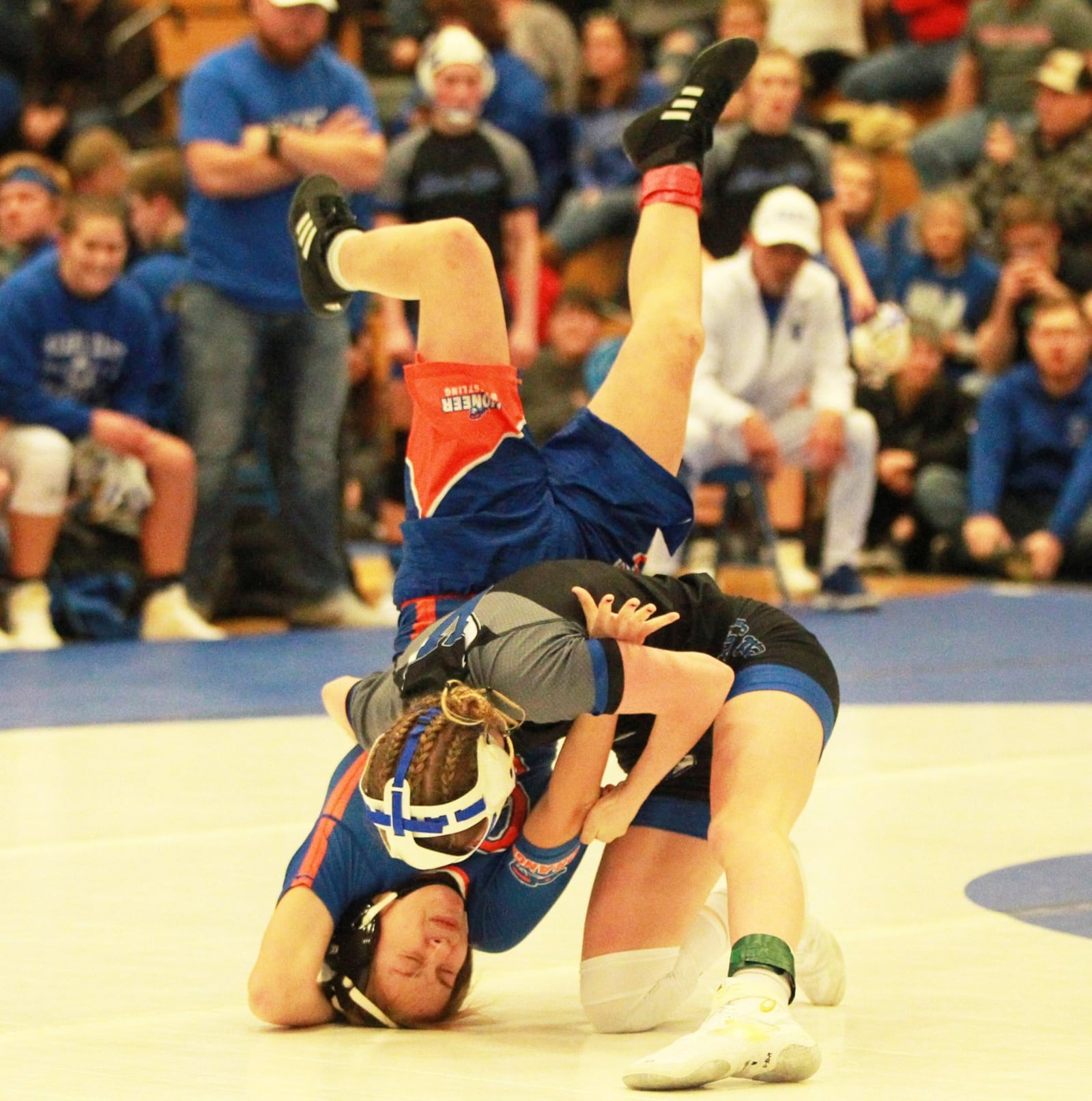 Olivia Shore of Miami East (top) takes down Ayla Castin. Olentangy Orange defeated host Miami East 48-36 in the Ohio’s first girls high school dual wrestling match on Wednesday, Dec. 18, 2019. MARC PENDLETON / STAFF