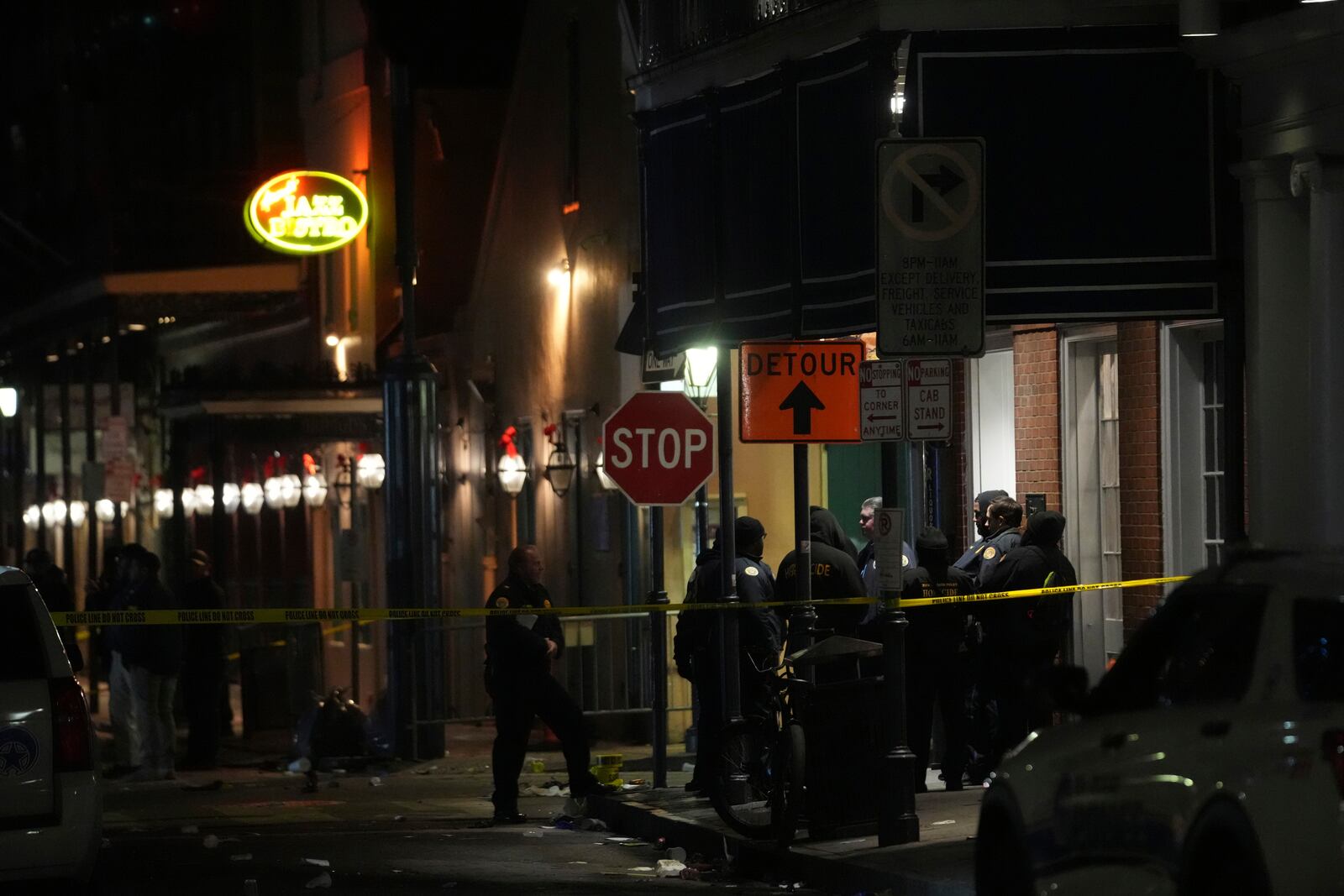 Emergency services attend the scene after a vehicle drove into a crowd on New Orleans' Canal and Bourbon Street, Wednesday Jan. 1, 2025. (AP Photo/Gerald Herbert)