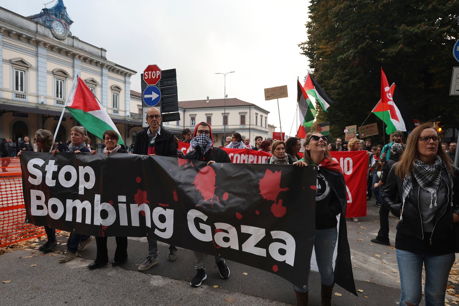 People take part in a pro-Palestinians protest ahead of the Nations League soccer match between Italy and Israel, in Udine, Italy, Monday, Oct. 14, 2024. (Riccardo Modena/LaPresse via AP)