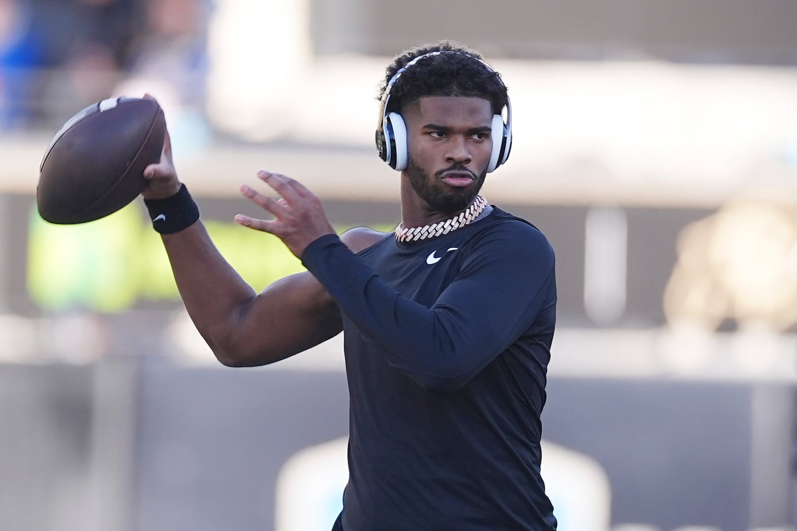 FILE - Colorado quarterback Shedeur Sanders (2) warms up before an NCAA college football game, Nov. 29, 2024, in Boulder, Colo. (AP Photo/David Zalubowski, File)