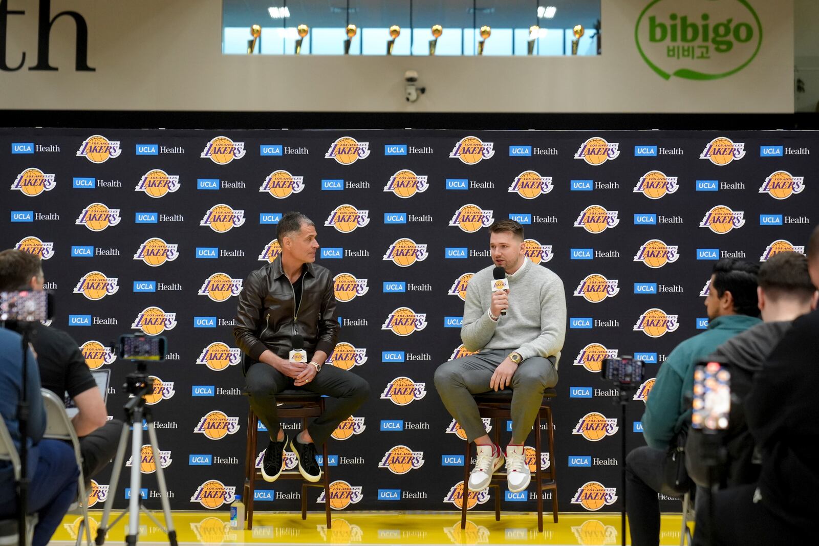 Los Angeles Lakers' Luka Doncic speaks next to general manager Rob Pelinka during an introductory NBA basketball press conference Tuesday, Feb. 4, 2025, in El Segundo, Calif. (AP Photo/Jae C. Hong)