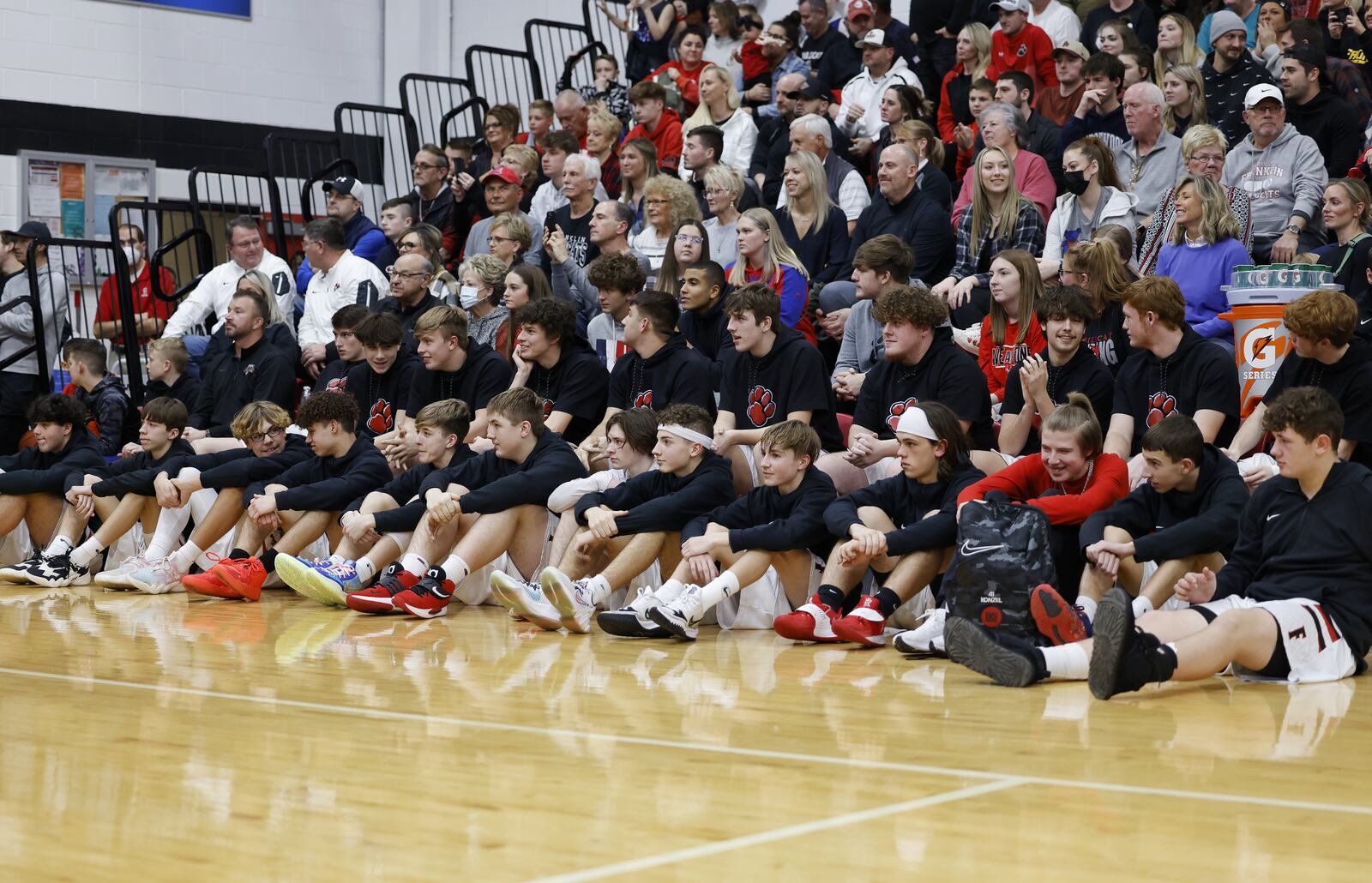 Franklin basketball players watch as former Franklin Wildcat and current Los Angeles Clippers basketball player Luke Kennard was honored by having his number 10 jersey retired before Franklin's basketball game against Springboro Tuesday, Feb. 1, 2022 in Franklin. NICK GRAHAM/STAFF