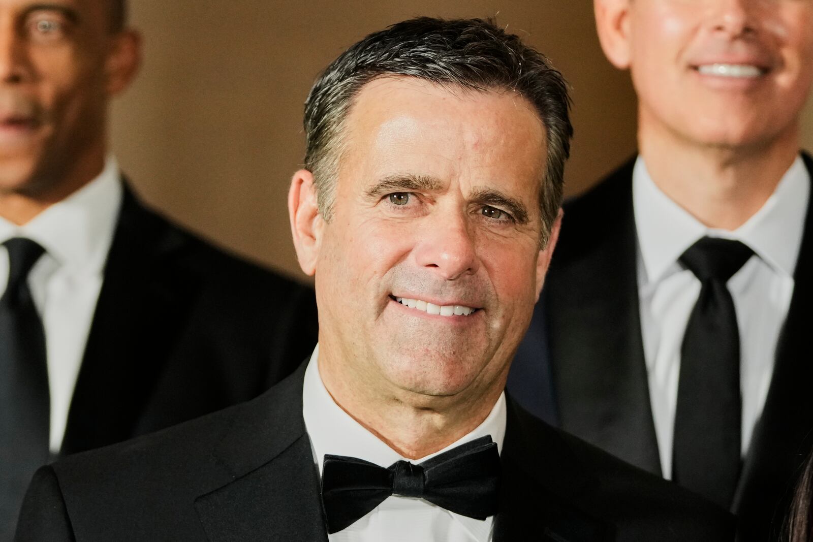 John Ratcliffe, President-elect Donald Trump's choice to be the Director of the Central Intelligence Agency, poses for a photo with Cabinet picks, other nominees and appointments, at the National Gallery of Art in Washington, Saturday, Jan. 18, 2025. (AP Photo/Mark Schiefelbein)