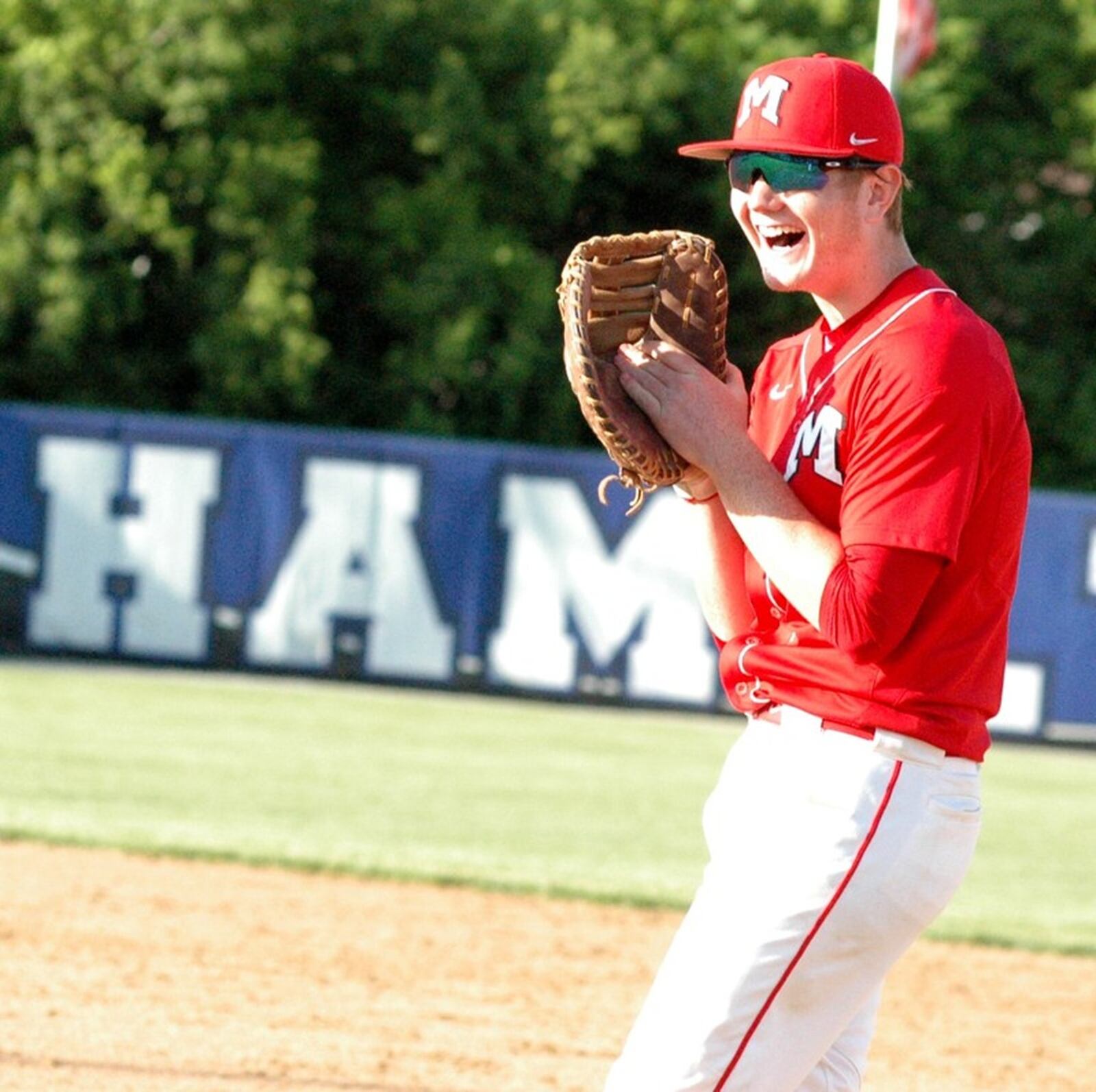 Madison’s Tristan Sipple has a laugh May 20 during a Division III district baseball semifinal against Indian Lake at Hamilton. Madison won 4-2. RICK CASSANO/STAFF