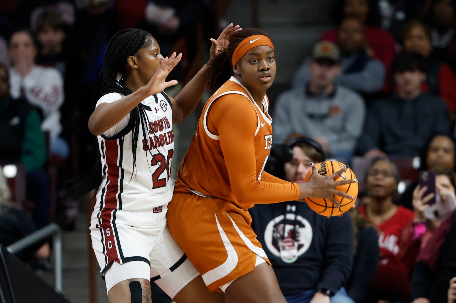 Texas forward Kyla Oldacre, right, looks to pass against South Carolina forward Sania Feagin during the first half of an NCAA college basketball game in Columbia, S.C., Sunday, Jan. 12, 2025. (AP Photo/Nell Redmond)