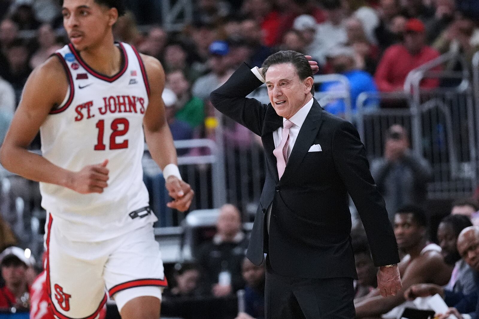 St. John's head coach Rick Pitino gestures towards his players during the first half in the second round of the NCAA college basketball tournament, Saturday, March 22, 2025, in Providence, R.I. (AP Photo/Charles Krupa)