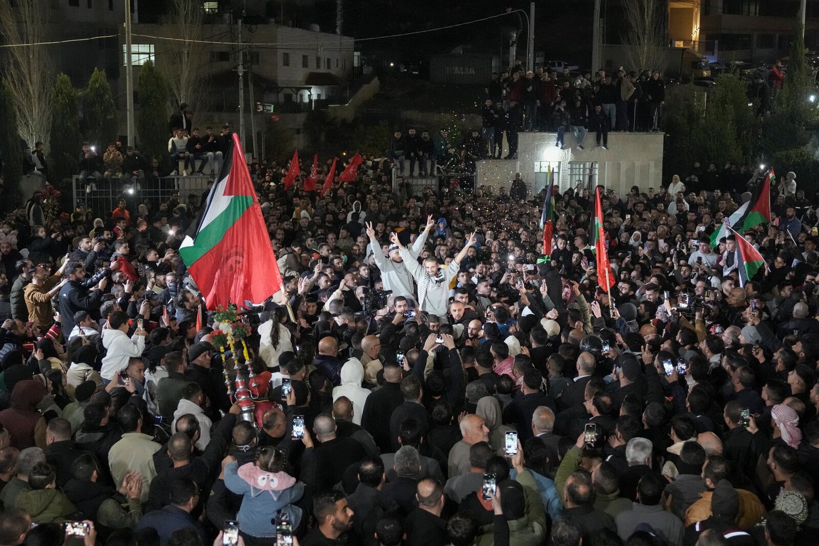 Crowd greets Palestinian prisoners after being released from Israeli prison following a ceasefire agreement between Israel and Hamas, in the West Bank city of Ramallah, Thursday, Jan. 30, 2025. (AP Photo/Mahmoud Illean)