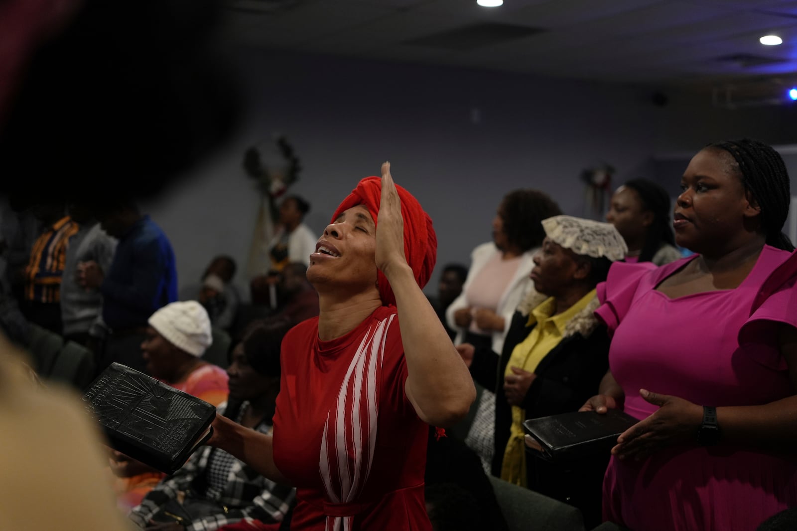 Congregants worship at the First Haitian Evangelical Church of Springfield, Sunday, January 26, 2025, in Springfield, Ohio. (AP Photo/Luis Andres Henao)