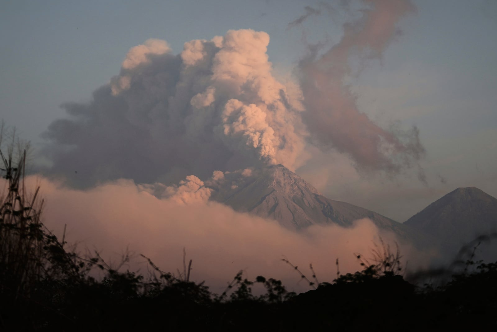 The "Volcan de Fuego," or Volcano of Fire, blows a thick cloud of ash, seen from Palin, Guatemala, Monday, March 10, 2025. (AP Photo/Moises Castillo)