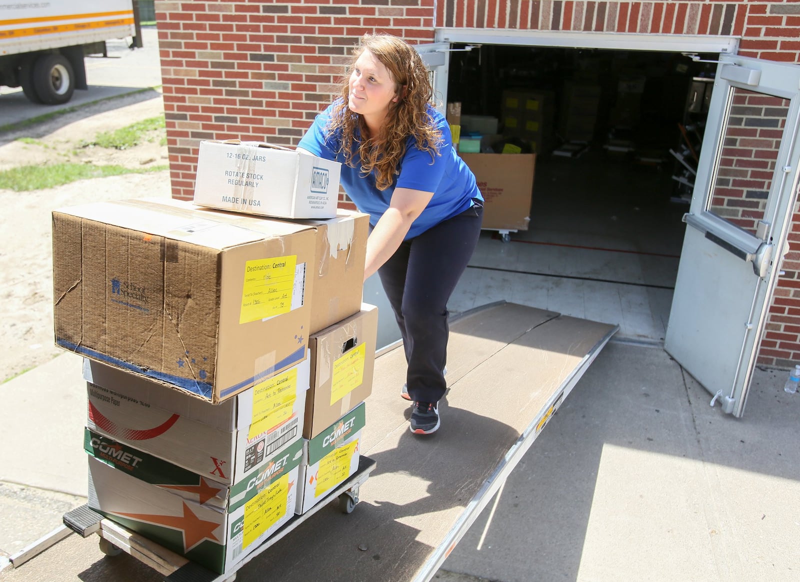 Crews from Planes Moving and Storage remove items from Fairfield Central Elementary on Tuesday, May 23. The building — Butler County’s second-oldest school — will be demolished in June. 