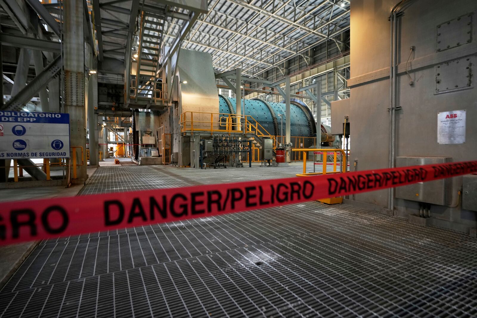 Tape blocks off an area of the Cobre Panamá copper mine, owned by Canada's First Quantum Minerals, in Donoso, Panama, Friday, March 21, 2025, during a press tour of the mine after it was closed by Panama's Supreme Court that ruled the government concession was unconstitutional. (AP Photo/Matias Delacroix)