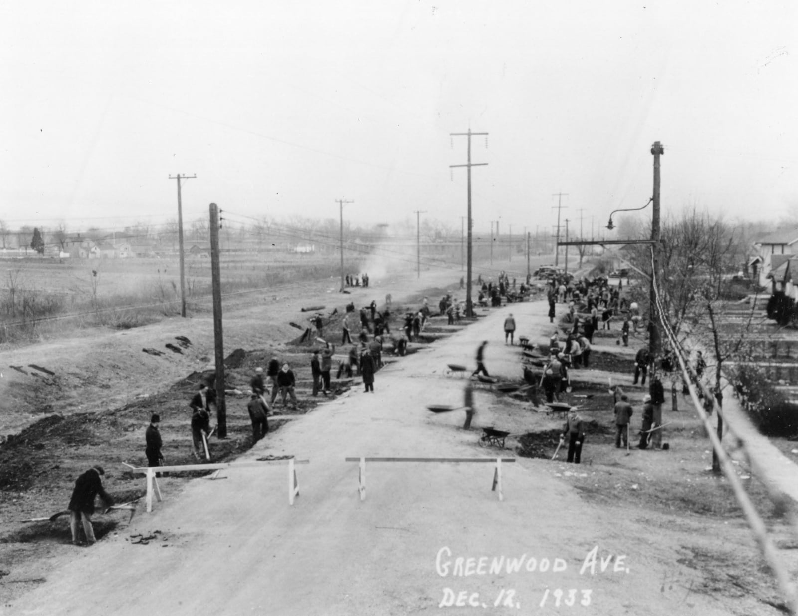 Miami & Erie Canal being filled in. C&D tracks are to the left of the canal bed. The street in the middle is Greenwood Avenue and part of the "Fordson Heights" subdivision. CREDIT: George C. Cummins "Remember When" Photograph Collection at the Hamilton Lane Library