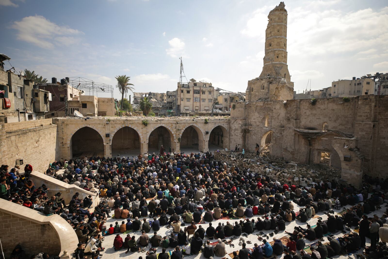 Palestinians gather to attend Friday prayers at the Great Omari Mosque, which was damaged during the Israeli military's air and ground operation in Gaza City, Friday, Feb. 14, 2025. (AP Photo/Jehad Alshrafi)