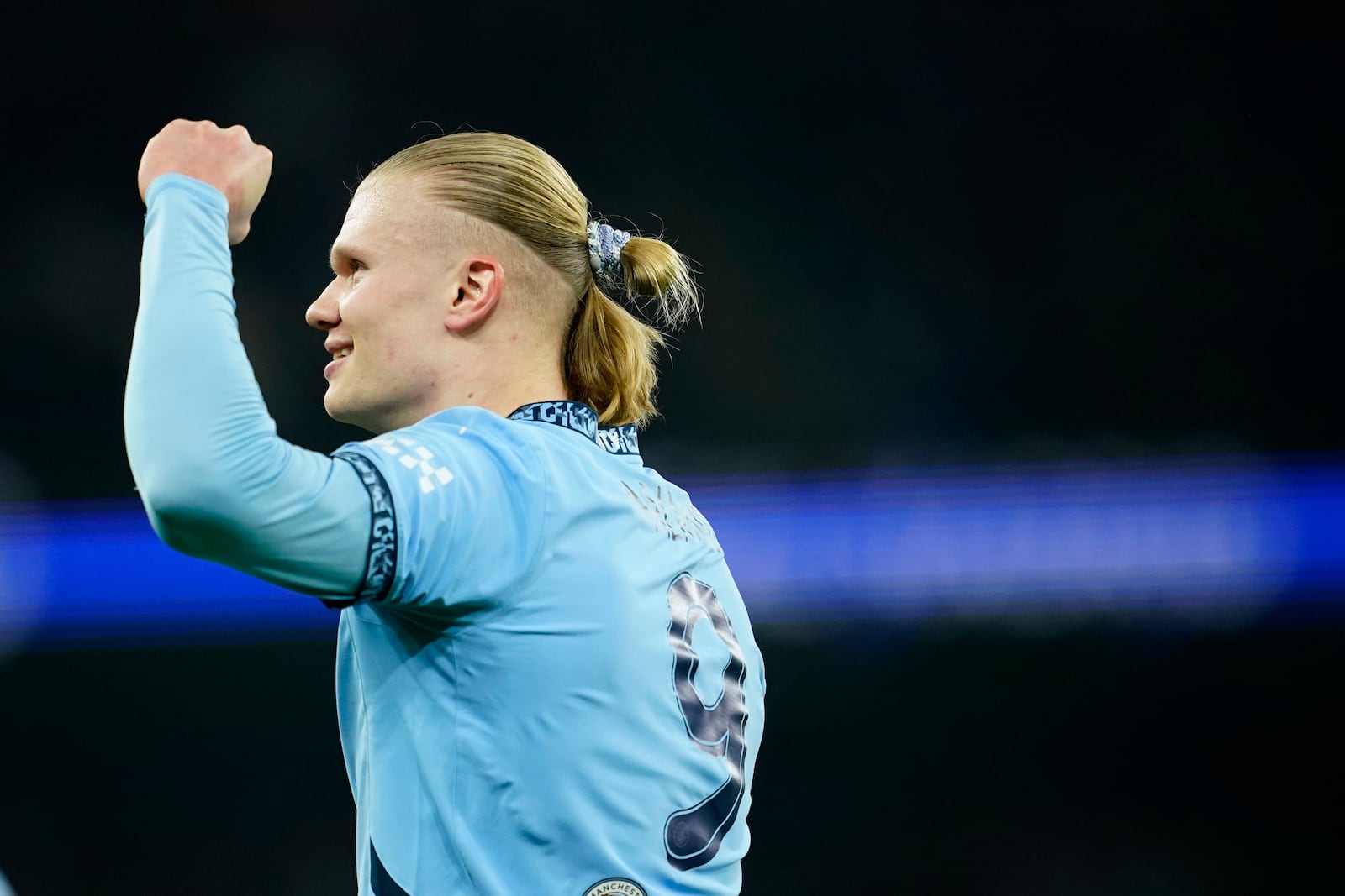 Manchester City's Erling Haaland celebrates after scoring his sides first goal during the Champions League playoff first leg soccer match between Manchester City and Real Madrid at the Etihad Stadium in Manchester, England, Tuesday, Feb. 11, 2025. (AP Photo/Dave Thompson)