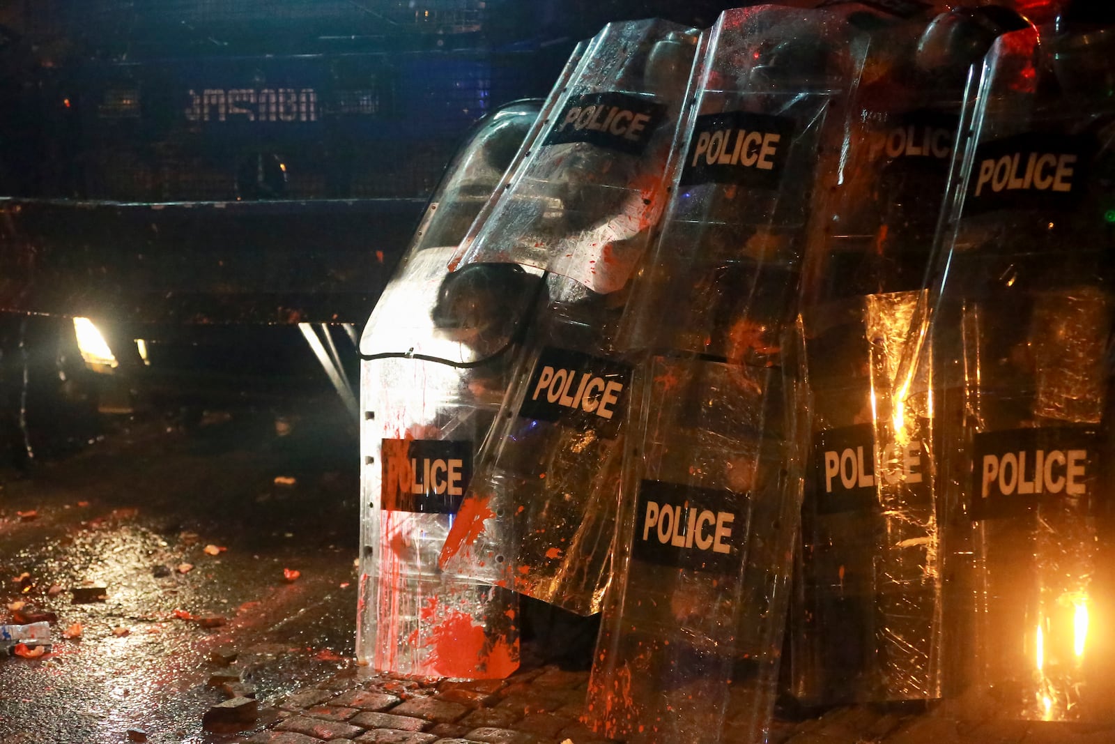 Police block a street to prevent protesters during a rally against the government's decision to suspend negotiations on joining the European Union for four years, outside the parliament in Tbilisi, Georgia, on Sunday, Dec. 1, 2024. (AP Photo/Zurab Tsertsvadze)