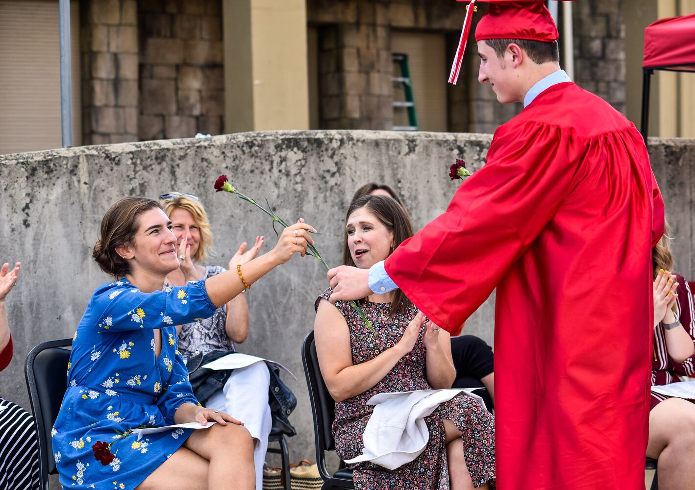 Madison High School drive-thru graduation ceremony at Land of Illusion