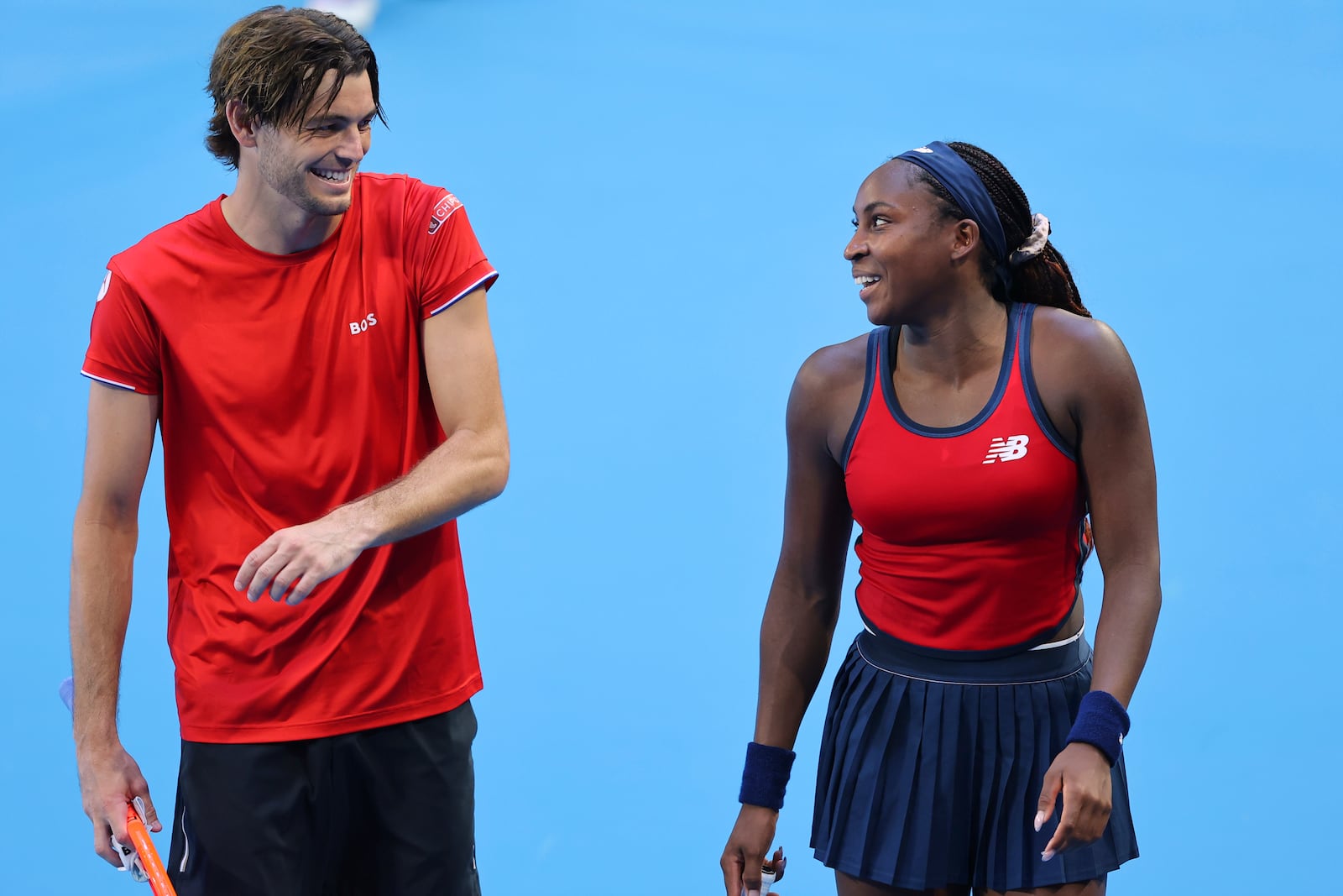 Taylor Fritz and Coco Gauff of the United States laugh as they celebrate defeating Petra Marcinko and Ivan Dodig of Croatia in their United Cup mixed doubles tennis match in Perth, Australia, Tuesday, Dec. 31, 2024. (AP Photo/Trevor Collens)