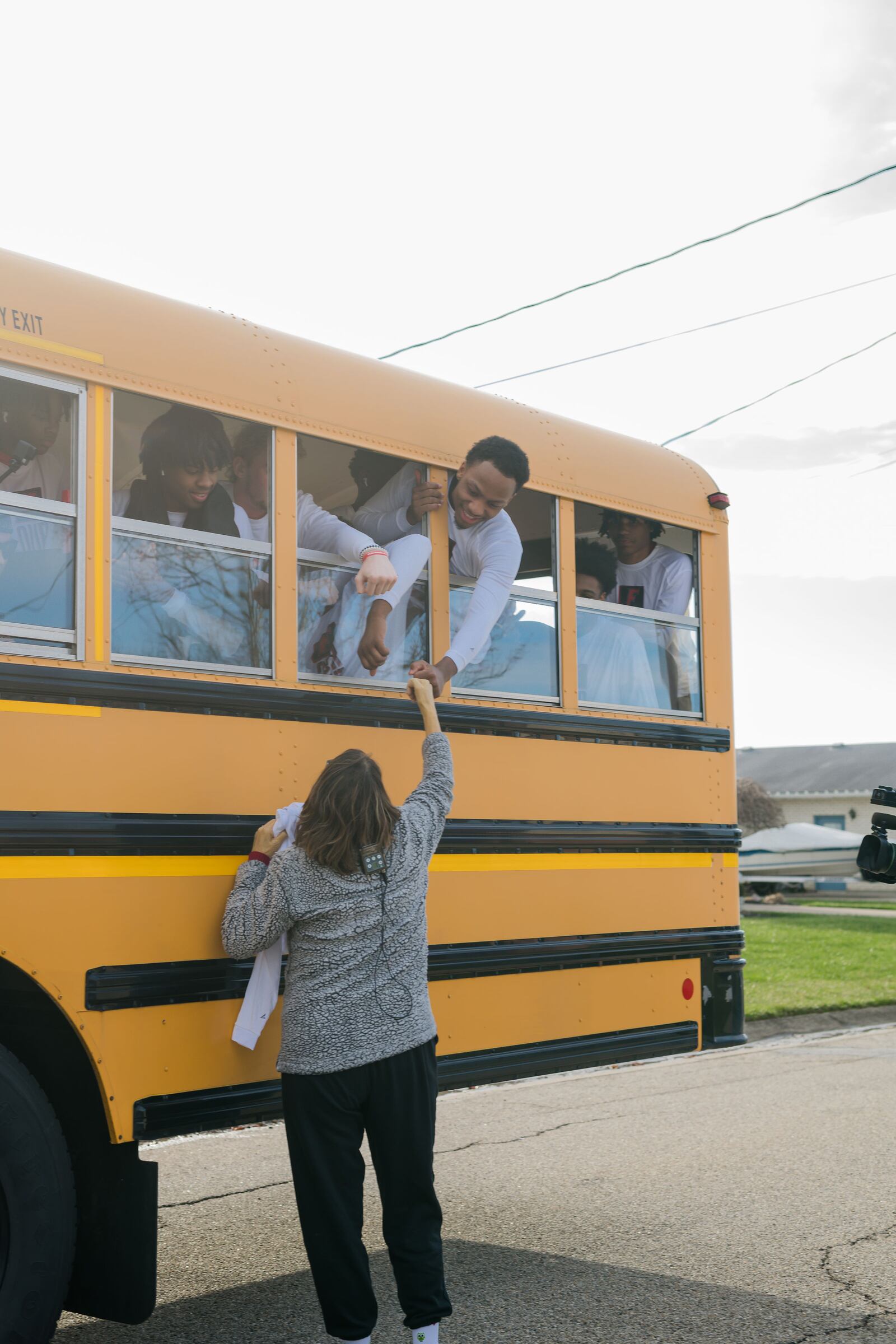 Sharon Revel visited with the Fairfield High School boys basketball team players when their bus rolled by her home for a surprise visit last weekend ahead of a game they were playing in Dayton. CONTRIBUTED