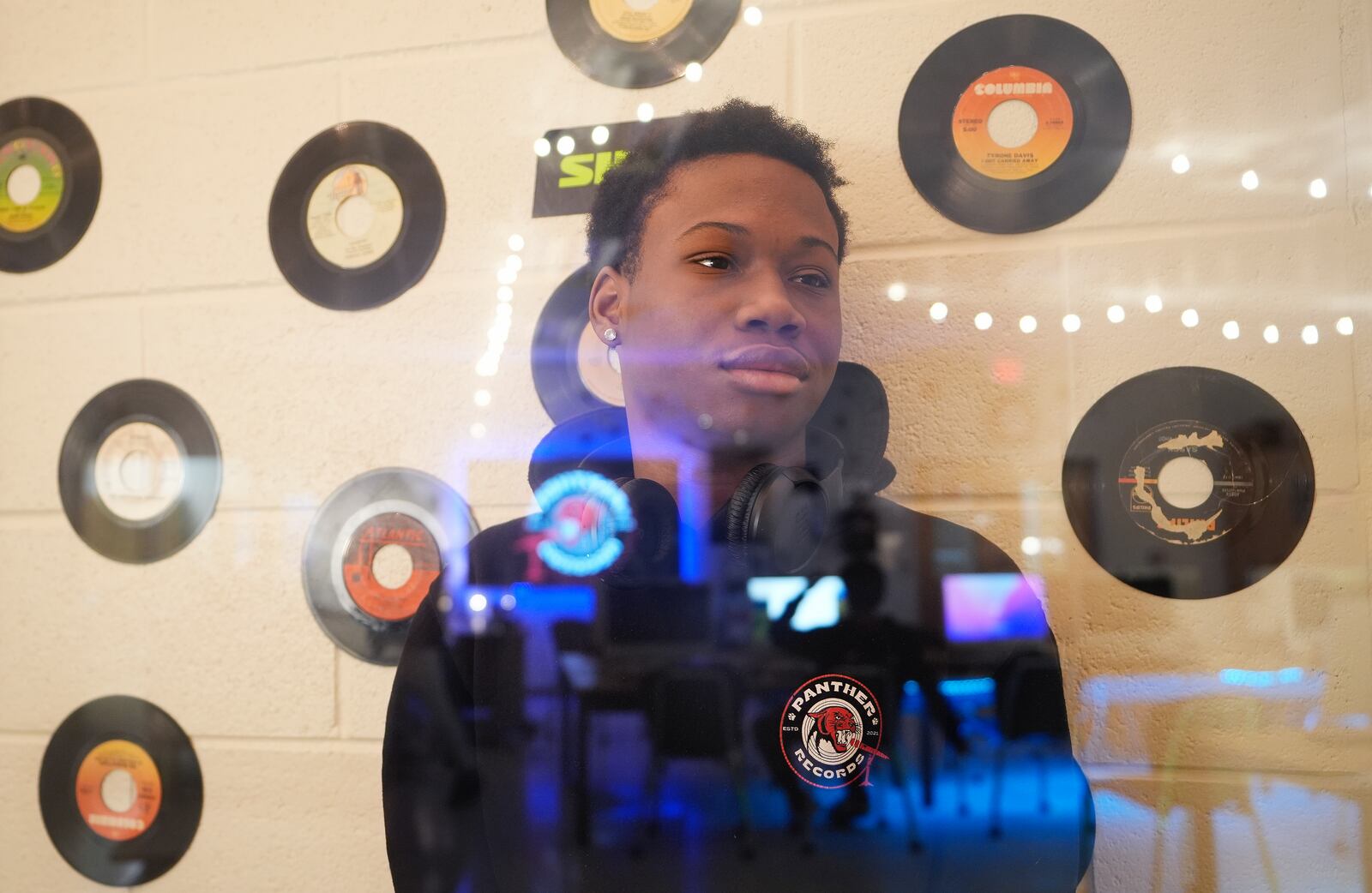 D. M. Therrell High School student Ja'Marion Hulin, 17, who runs the school's record company, Panther Records, poses for a photograph Monday, Jan. 27, 2025, in Atlanta. (AP Photo/Brynn Anderson)