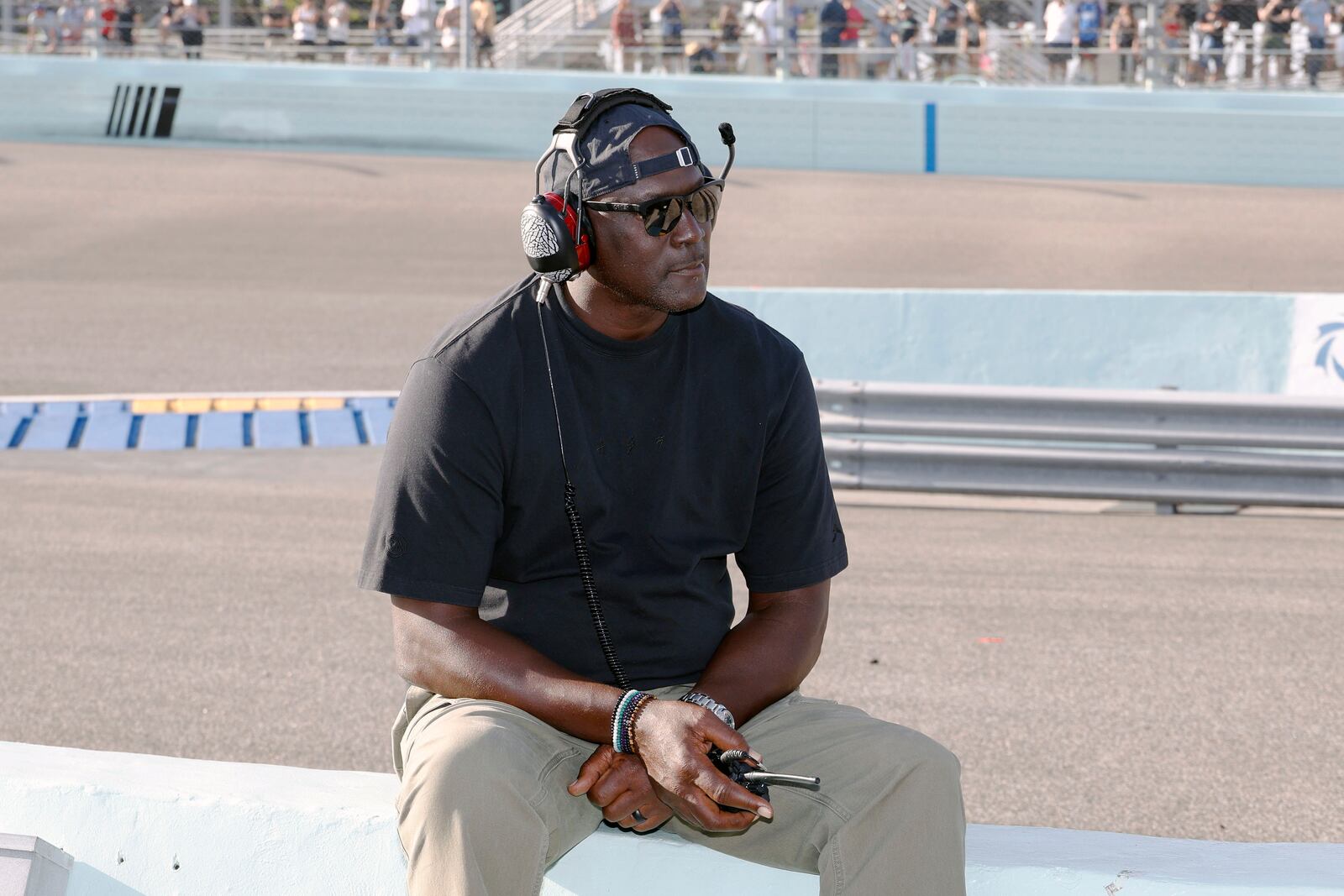 Car owner Michael Jordan watches from the pits during a NASCAR Cup Series auto race at Homestead-Miami Speedway in Homestead, Fla., Sunday, Oct. 27, 2024. (AP Photo/Terry Renna)