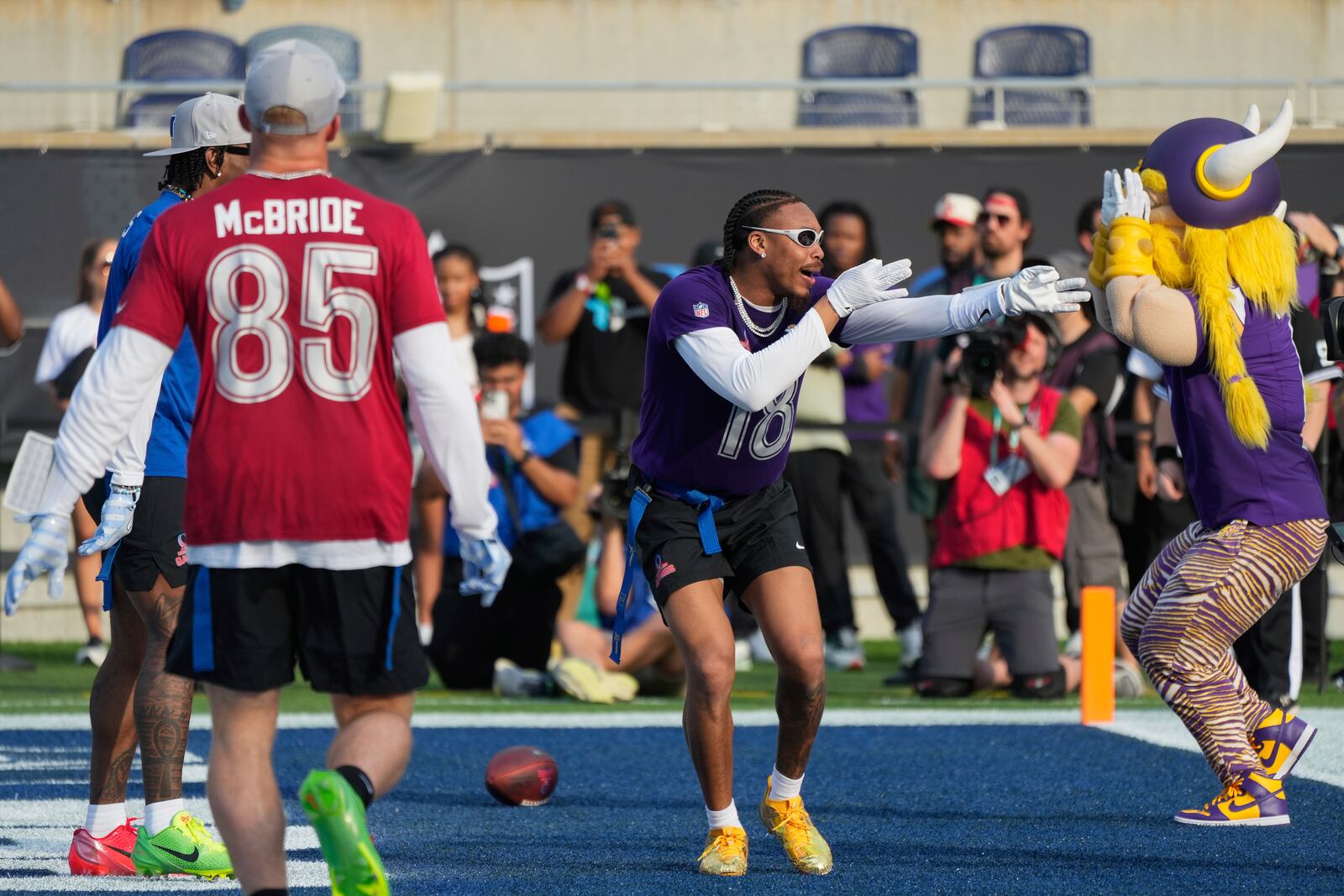 NFC wide receiver Justin Jefferson (18), of the Minnesota Vikings, celebrates after scoring a touchdown during the flag football event at the NFL Pro Bowl, Sunday, Feb. 2, 2025, in Orlando. (AP Photo/John Raoux)