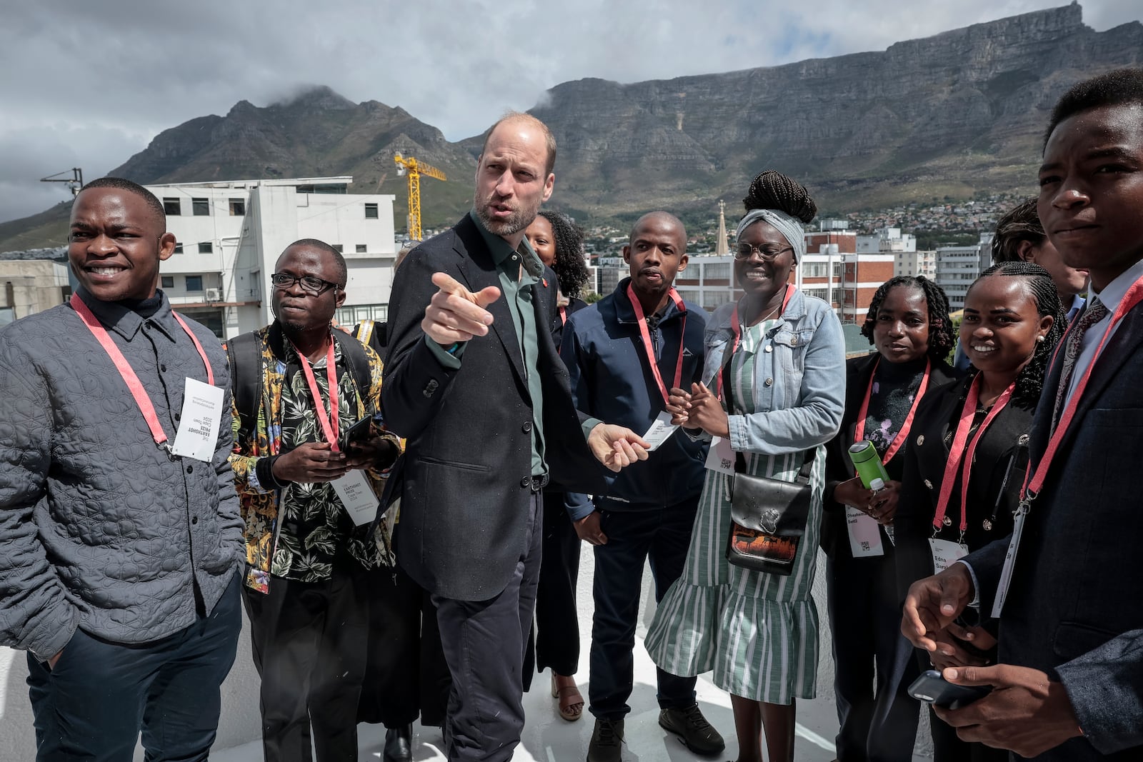 Britain's Prince William, speaks to a group of young people, with Table Mountain in the background at the Earthshot Prize Climate Leaders Youth Programme at Rooftop on Bree in Cape Town, South Africa, Monday Nov. 4, 2024. (Gianluigi Guercia/Pool Photo via AP)