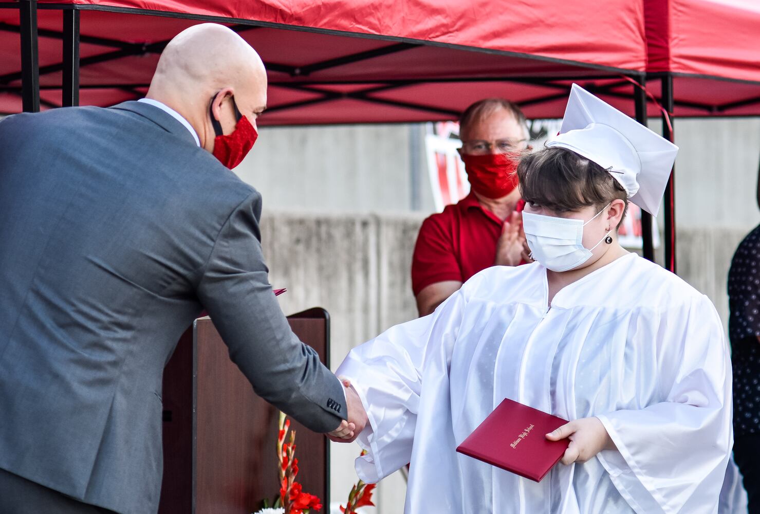 Madison High School drive-thru graduation ceremony at Land of Illusion