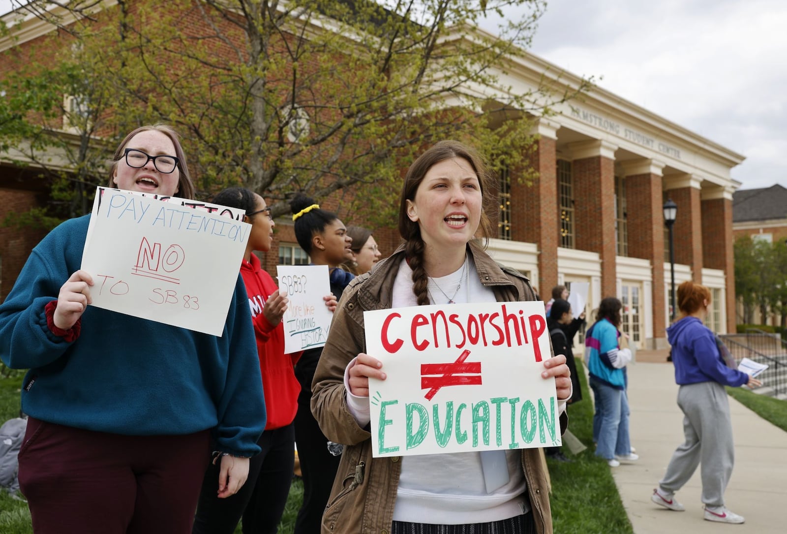 A proposed Ohio bill now in the state senate today drew a public protest by Miami University students on campus who claim the legislation would smother free speech, school inclusion efforts and more at state colleges. Dozens of Miami students rallied against Ohio Senate Bill 83 this afternoon in front the school’s Armstrong Student Center on the school’s main Oxford campus. (Photo By Nick Graham\Journal-News)